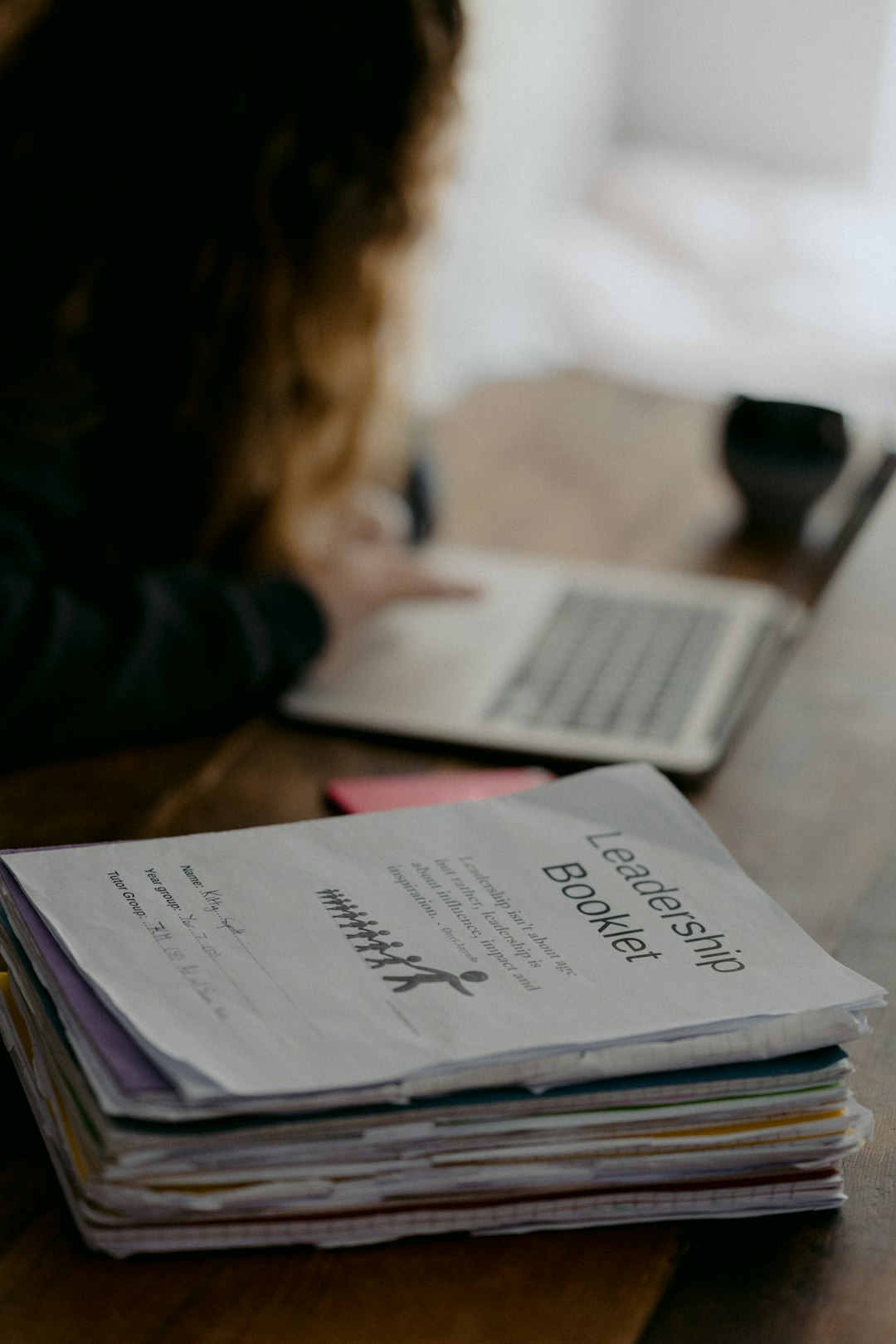 Young teen doing schoolwork at home after UK schools close due to the Coronavirus.